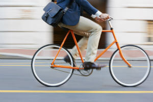 business person riding bicycle in the street