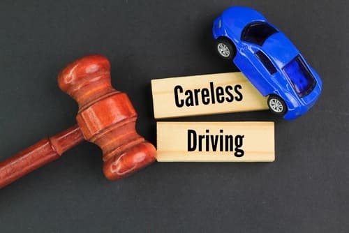 careless driving blocks with gavel and car