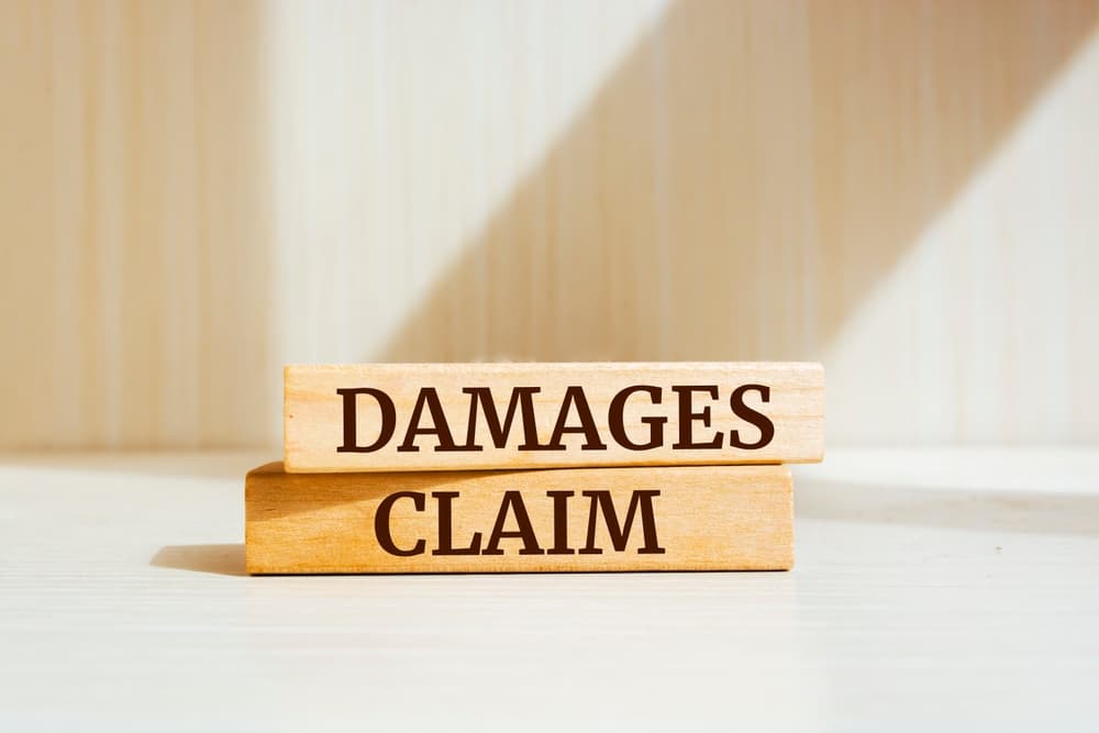 Damages & Claims written on wooden blocks